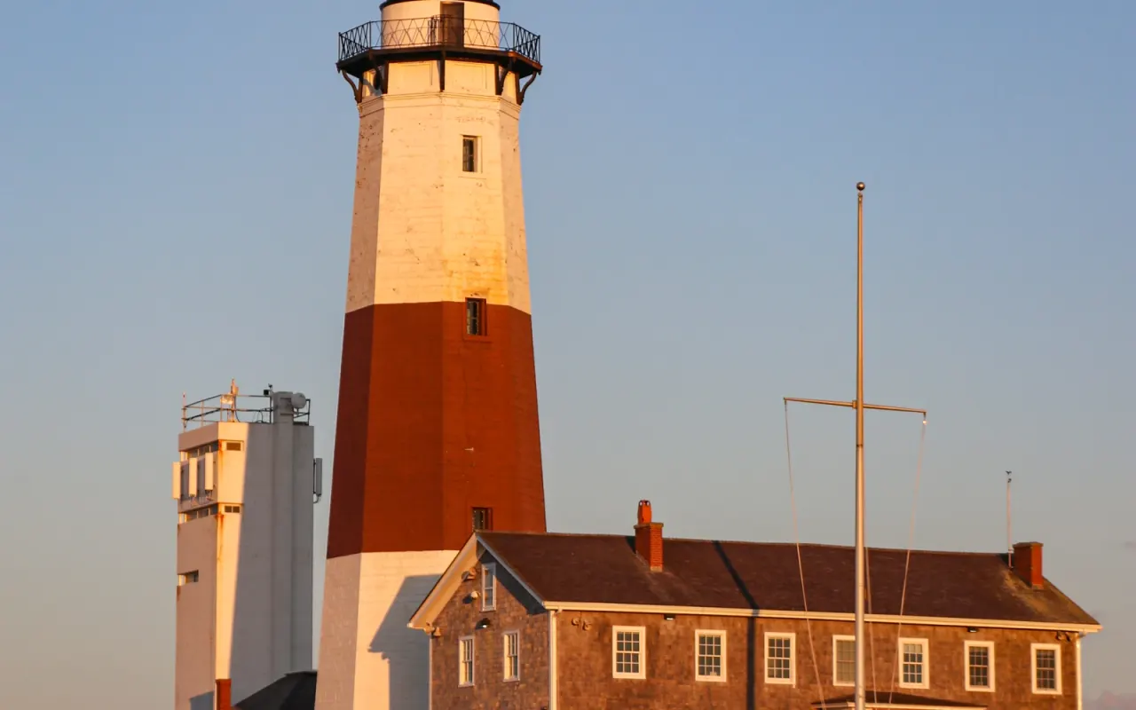 Montauk Point Lighthouse with its keeper's house at golden hour
